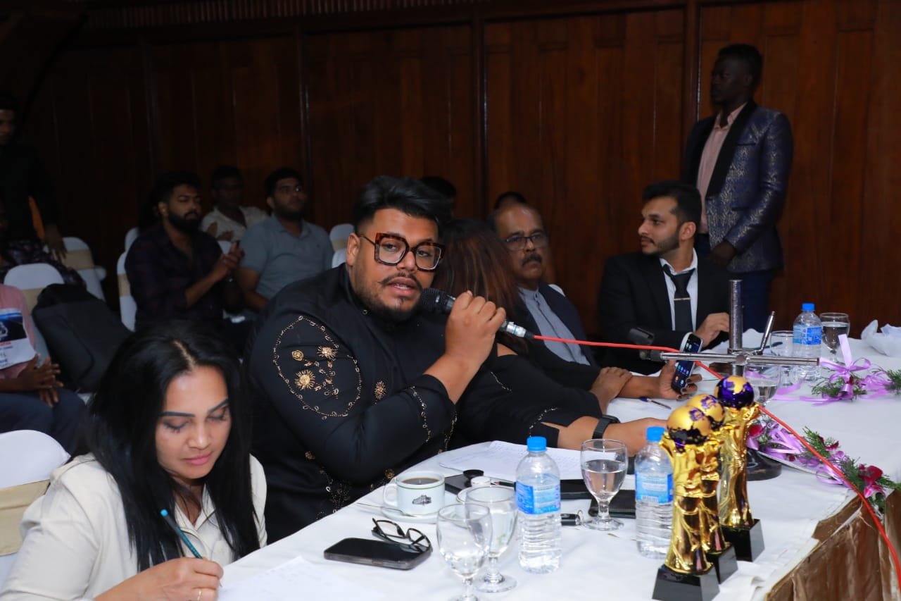 Professional judges panel at talent show with scorecards